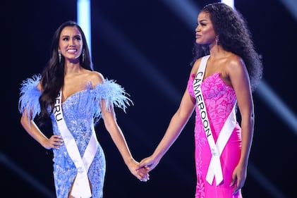 SAN SALVADOR, EL SALVADOR - NOVEMBER 18: Miss Peru Camila Escribens and Miss Cameroon Issie Marie Princesse hold hands during the 72nd Miss Universe Competition at Gimnasio Nacional José Adolfo Pineda on November 18, 2023 in San Salvador, El Salvador. (Photo by Hector Vivas/Getty Images)