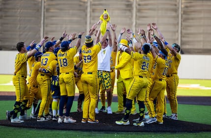 NEW YORK, NEW YORK - AUGUST 11:  Savannah Bananas owner Jesse Cole and team welcome a Banana Baby before their game against the Staten Island Ferryhawks at Richmond County Bank Ball Park on August 11, 2023 in New York City.  The Savannah Bananas were part of the Coastal Plain League, a summer collegiate league, for seven seasons. In 2022, the Bananas announced that they were leaving the Coastal Plain League to play Banana Ball year-round. Banana Ball was born out of the idea of making baseball more fast-paced, entertaining, and fun.   (Photo by Al Bello/Getty Images)