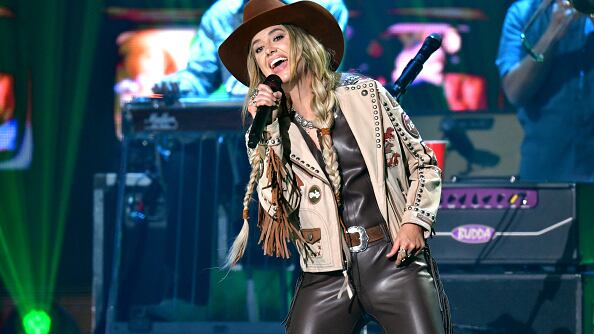 Lainey Wilson performing on stage